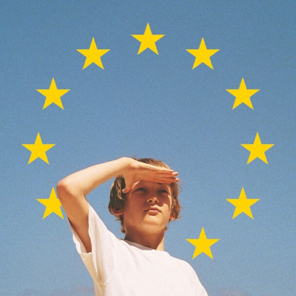 Youth Guarantee Cover - Young person looking far into the distance, the sky with the eu stars behind him